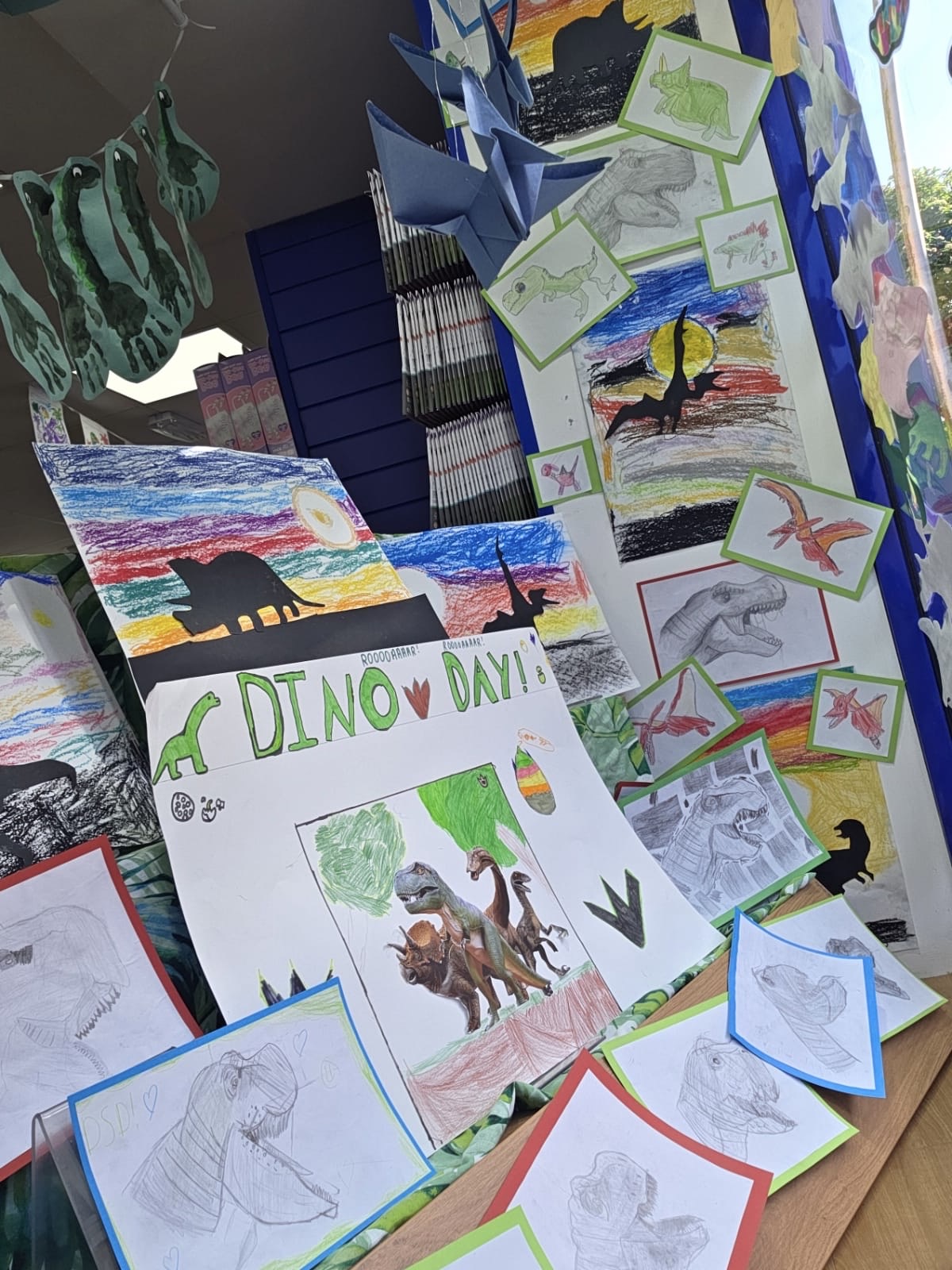 Local pupils create Jurassic inspired window display for Dino Day